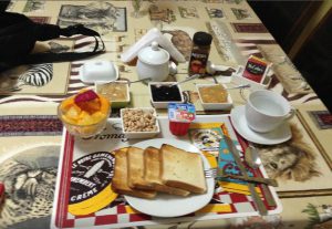 a typical breakfast with fresh fruit salad